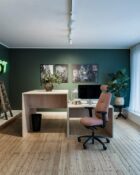Logic 220 ergonomic task chair in an office setting. Chair is shown with headrest and adjustable arms.