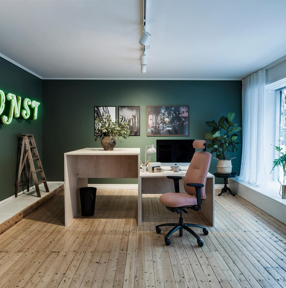 Logic 220 ergonomic task chair in an office setting. Chair is shown with headrest and adjustable arms.
