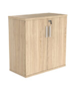 2 door storage cupboard. Canadian oak wood finish. Shown with lock, 2 keys and silver handles.