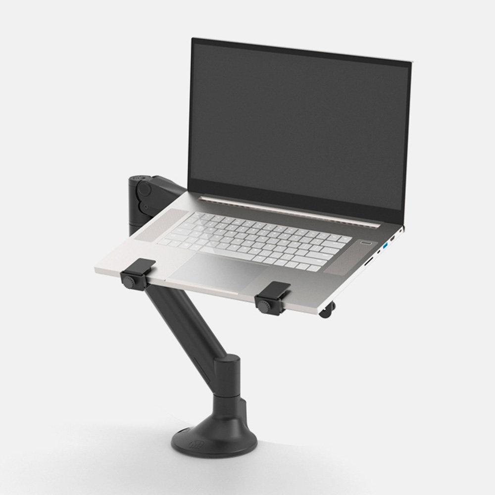 Gas lift levo desktop laptop stand showing a laptop in the stand.