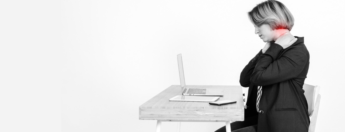 women experiencing neck pain from poor posture at work