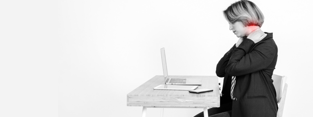 women experiencing neck pain from poor posture at work