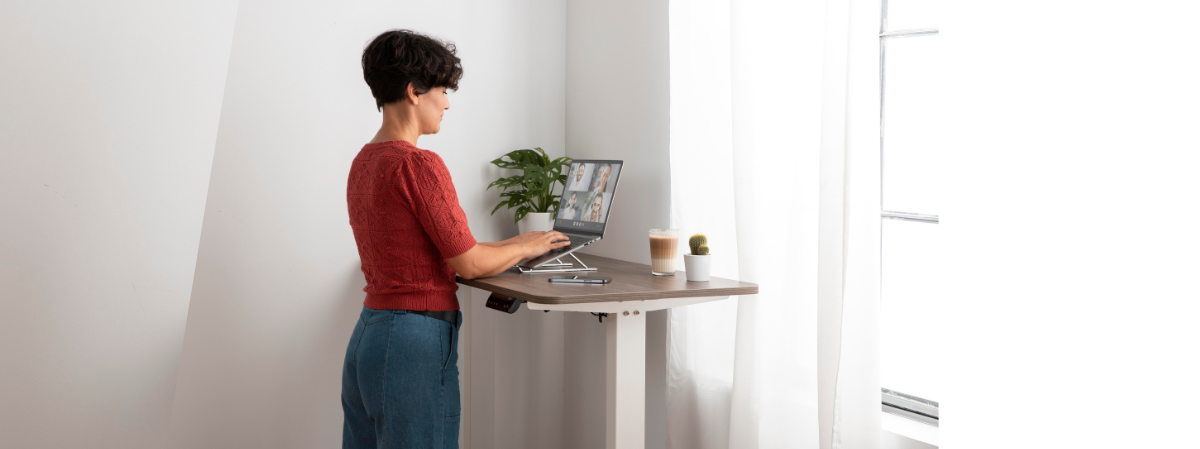 women using her standing desk