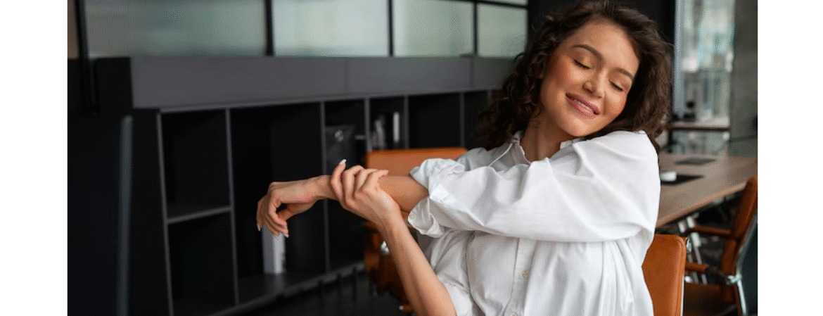 women stretching sat at her desk