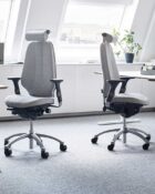 Logic 400 - Ergonomic office chair with neckrest and adjustable arms, featuring a sculptured seat and supportive lumbar back.
